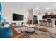 Open living room and kitchen with brown furniture at 1536 Axel Cir, Winter Haven, FL 33880