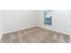 Carpeted bedroom featuring a window with blinds, providing a cozy and well-lit space at 308 Bass Ct, Poinciana, FL 34759