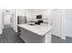 A close-up view of the island sink and granite countertops in the kitchen at 308 Bass Ct, Poinciana, FL 34759