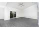 The living room has sliding glass doors leading to a patio and backyard at 308 Bass Ct, Poinciana, FL 34759