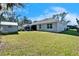 Spacious backyard with shed, patio, and lush lawn at 4714 Dail Rd, Lakeland, FL 33813