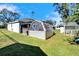 Large backyard with shed, greenhouse, and hot tub at 4714 Dail Rd, Lakeland, FL 33813
