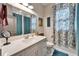 Clean bathroom with white vanity and teal accents at 4714 Dail Rd, Lakeland, FL 33813