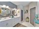 Double vanity bathroom with a large mirror and walk in shower at 4714 Dail Rd, Lakeland, FL 33813