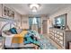 Main bedroom with a large bed, dresser, and decorative rug at 4714 Dail Rd, Lakeland, FL 33813