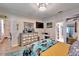 Bedroom with large dresser, TV, and access to bathroom at 4714 Dail Rd, Lakeland, FL 33813