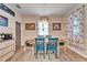 Charming dining room with a rustic wooden table and teal chairs at 4714 Dail Rd, Lakeland, FL 33813