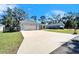 Long driveway leading to a charming house with a two-car garage at 4714 Dail Rd, Lakeland, FL 33813