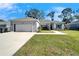 Newly constructed home with a two-car garage and well-manicured lawn at 4714 Dail Rd, Lakeland, FL 33813