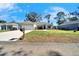 House exterior showcasing a spacious front yard and driveway at 4714 Dail Rd, Lakeland, FL 33813