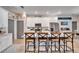 Modern kitchen with white cabinets, granite countertops and a breakfast bar at 4714 Dail Rd, Lakeland, FL 33813