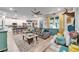 Open concept living room with kitchen views and a cozy sectional sofa at 4714 Dail Rd, Lakeland, FL 33813