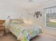 bedroom with whimsical decor and a patchwork quilt at 3189 Winchester Estates Loop, Lakeland, FL 33810