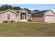 Single-story house with solar panels and landscaping at 3189 Winchester Estates Loop, Lakeland, FL 33810