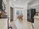 Kitchen with white cabinets, black appliances, and eat-in area at 3189 Winchester Estates Loop, Lakeland, FL 33810