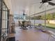 Relaxing screened porch with seating and ceiling fan at 3189 Winchester Estates Loop, Lakeland, FL 33810