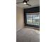 Bedroom with dark blue accent wall, carpet, and window at 1280 Travertine Ter, Sanford, FL 32771