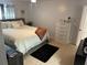 Spacious bedroom with king-size bed and dresser at 401 Century Blvd # C, Auburndale, FL 33823