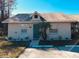 Cute single story home with green door and well-manicured landscaping at 401 Century Blvd # C, Auburndale, FL 33823