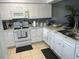 Modern kitchen with white cabinetry and ample counter space at 401 Century Blvd # C, Auburndale, FL 33823
