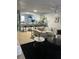 Open concept kitchen and living area with breakfast bar at 401 Century Blvd # C, Auburndale, FL 33823