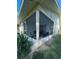 Spacious screened porch with seating area at 401 Century Blvd # C, Auburndale, FL 33823