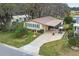 Aerial view of a single-Gathering home with golf course nearby at 1724 Magnolia Ave, Lady Lake, FL 32159