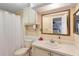 Clean bathroom with vanity, toilet, shower, and mirrored medicine cabinet at 1724 Magnolia Ave, Lady Lake, FL 32159