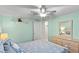 Bedroom with ceiling fan, wood floors, and built-in shelving at 1724 Magnolia Ave, Lady Lake, FL 32159