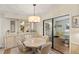 Bright dining room with an octagonal table and built-in hutch at 1724 Magnolia Ave, Lady Lake, FL 32159