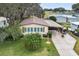 Single-story home with carport and well-maintained landscaping at 1724 Magnolia Ave, Lady Lake, FL 32159