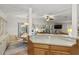 Open kitchen features a breakfast bar and view into adjacent living area at 1724 Magnolia Ave, Lady Lake, FL 32159