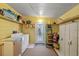 Functional laundry room with washer, dryer, and ample storage at 1724 Magnolia Ave, Lady Lake, FL 32159