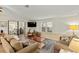 Spacious living room with comfortable seating and a large TV at 1724 Magnolia Ave, Lady Lake, FL 32159