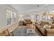 Living room with two sofas, a coffee table, and wood floors at 1724 Magnolia Ave, Lady Lake, FL 32159