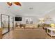 Living area with sectional sofa and a view into another room at 1724 Magnolia Ave, Lady Lake, FL 32159