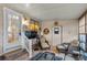 Relaxing screened porch with wicker furniture and view of the kitchen at 1724 Magnolia Ave, Lady Lake, FL 32159