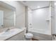 Bright bathroom with white tiles, a bathtub, and a modern vanity at 6244 Sw 96Th Pl, Ocala, FL 34476