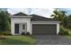 One-story home with a two-car garage and landscaping at 6244 Sw 96Th Pl, Ocala, FL 34476