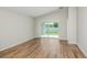 Living area featuring wood-look floors and sliding glass doors to the outdoor space at 6244 Sw 96Th Pl, Ocala, FL 34476