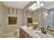 Double vanity bathroom with large mirror and decorative wall art at 8710 Hinsdale Heights Dr, Polk City, FL 33868