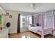 bedroom with a canopy bed and ivy wall decor at 8710 Hinsdale Heights Dr, Polk City, FL 33868