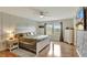 Spacious main bedroom with wood floors and large windows at 8710 Hinsdale Heights Dr, Polk City, FL 33868