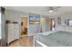 Main bedroom with ensuite bathroom, walk-in closet, and brick feature wall at 8710 Hinsdale Heights Dr, Polk City, FL 33868