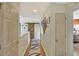Upstairs hallway with barn door and hardwood floors at 8710 Hinsdale Heights Dr, Polk City, FL 33868