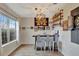 Home bar with rustic wood and metal finishes, including a dartboard at 8710 Hinsdale Heights Dr, Polk City, FL 33868