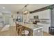 Modern kitchen with granite countertops and white cabinets at 8710 Hinsdale Heights Dr, Polk City, FL 33868