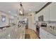 Modern kitchen with granite countertops and white cabinets at 8710 Hinsdale Heights Dr, Polk City, FL 33868