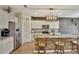 Modern kitchen with granite countertops and white cabinets at 8710 Hinsdale Heights Dr, Polk City, FL 33868