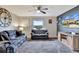 Bright living room with comfortable seating and wood floors at 8710 Hinsdale Heights Dr, Polk City, FL 33868